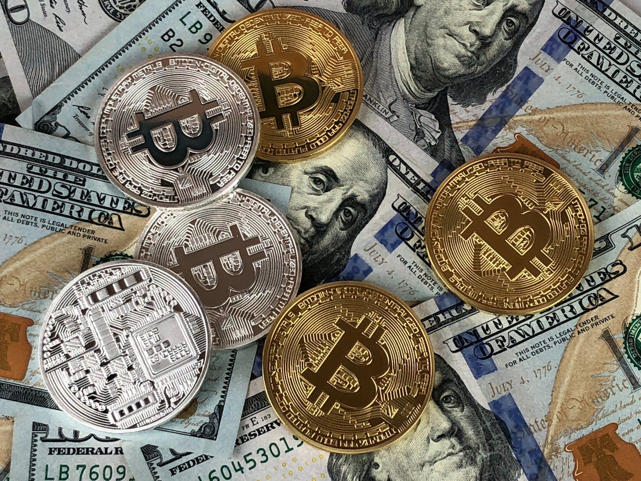 who-we-are Close-up of bitcoins and US dollar bills symbolizing modern finance and cryptocurrency.